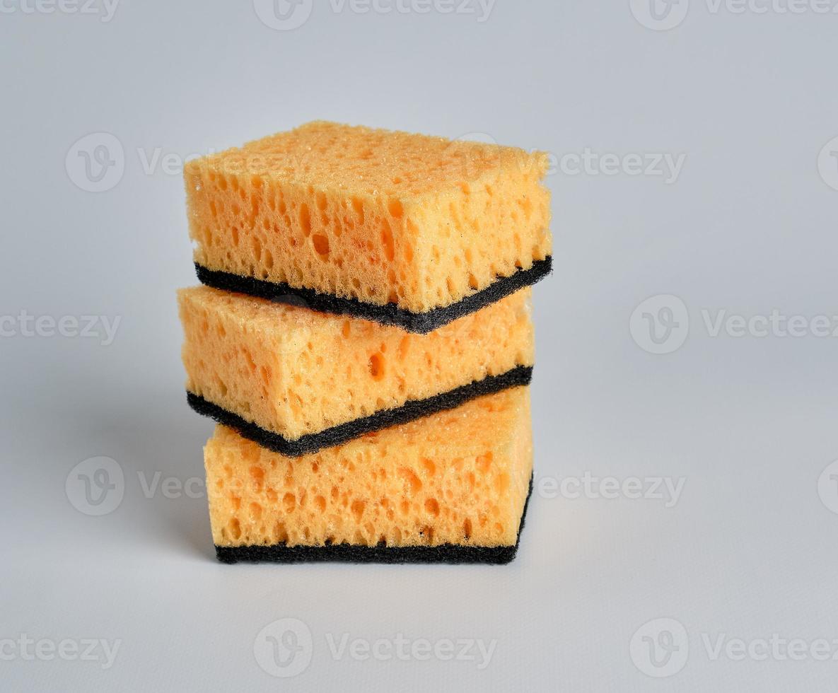stack-of-yellow-kitchen-sponges-for-washing-dishes-19428658-stock-photo