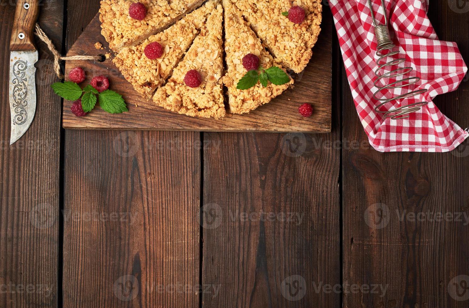 sliced triangular pieces of crumble pie with apples photo