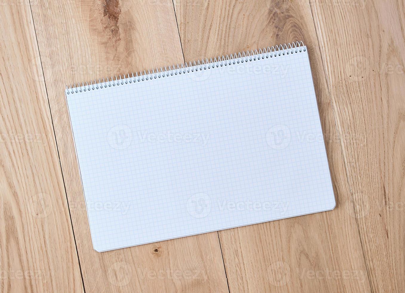 open notebook with a cell with empty sheets photo