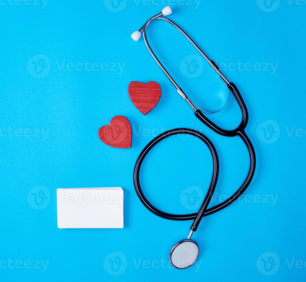 medical stethoscope and empty paper business cards photo