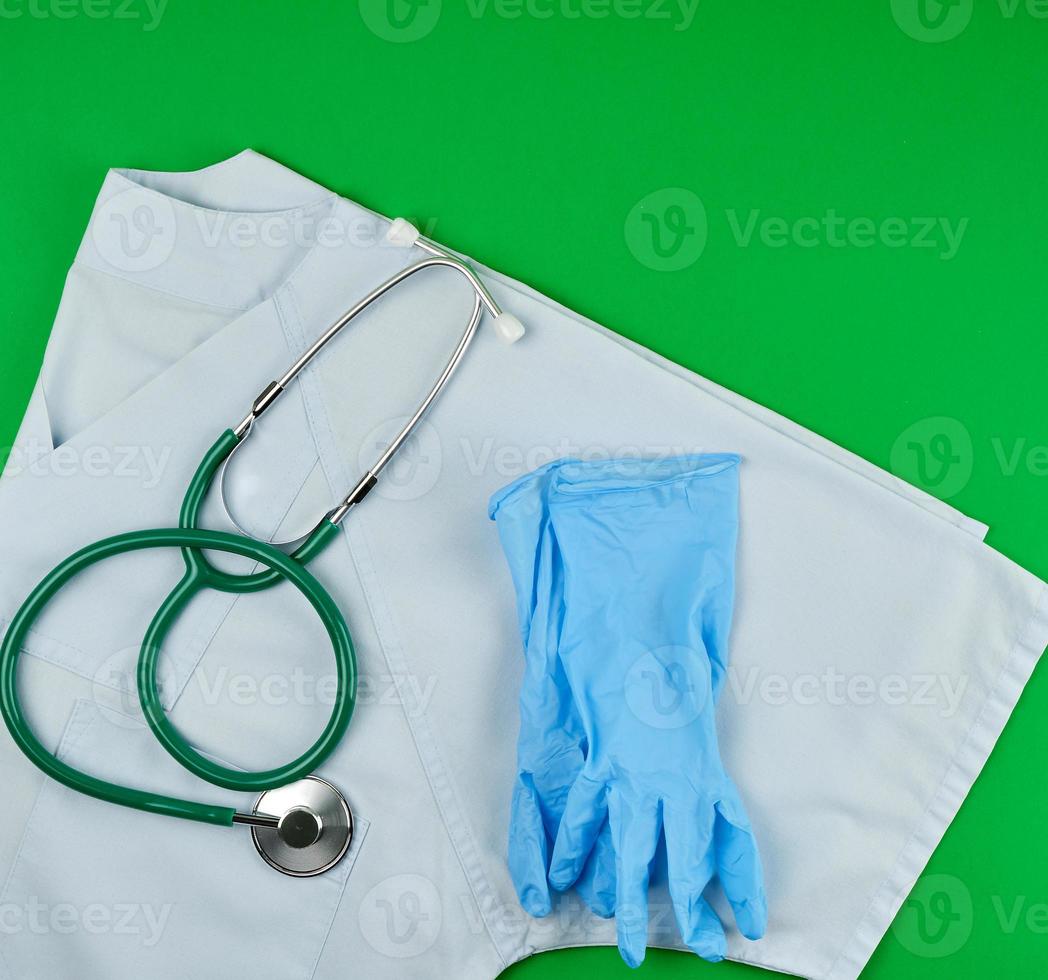 blue medic uniform and green stethoscope photo