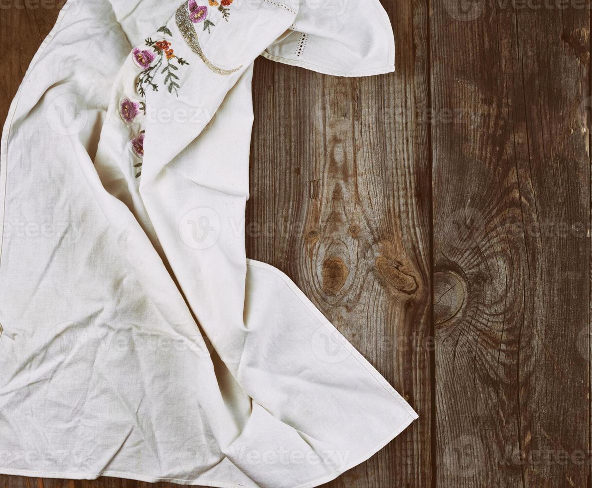 textile dishcloth on a gray wooden background photo