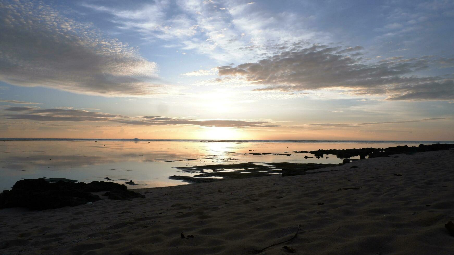 Sunset on the beach. Paradise beach. Tropical paradise, white sand, beach,  and clear water. Landscape with sea sunset on beach. photo