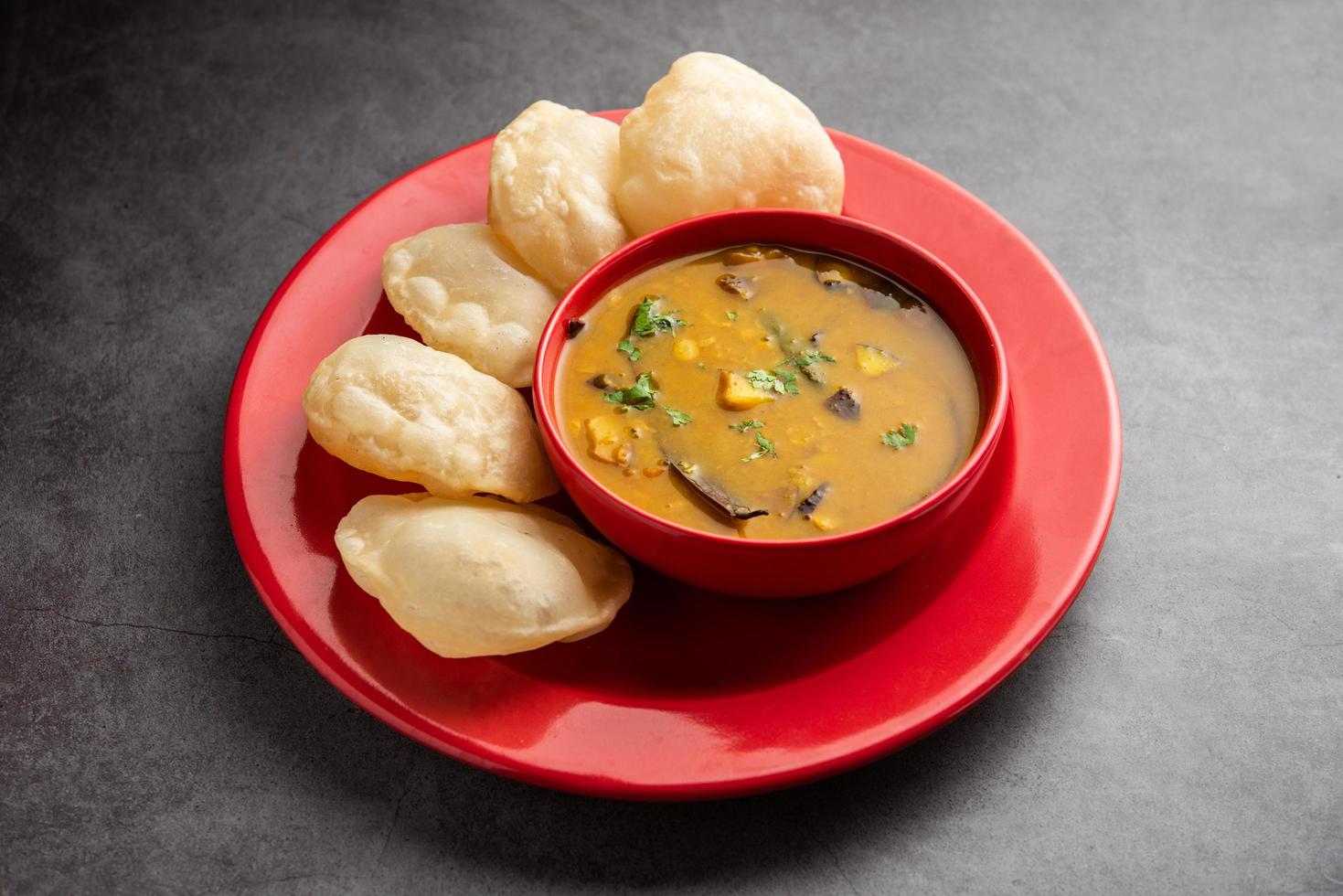 Luchi Cholar Dal or Fried bread made of flour served along with curried Chana or Bengal gram photo