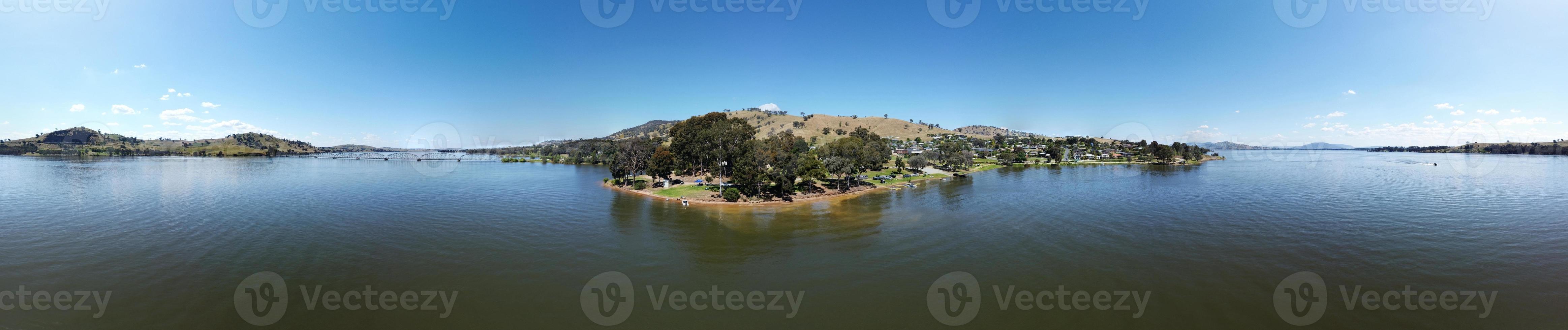 360 degree photography of Overlooking Lake Hume is the picturesque town of Bellbridge, offering views of nearby Bethanga Bridge in Albury NSW, Australia, the calm water shot by drone. photo