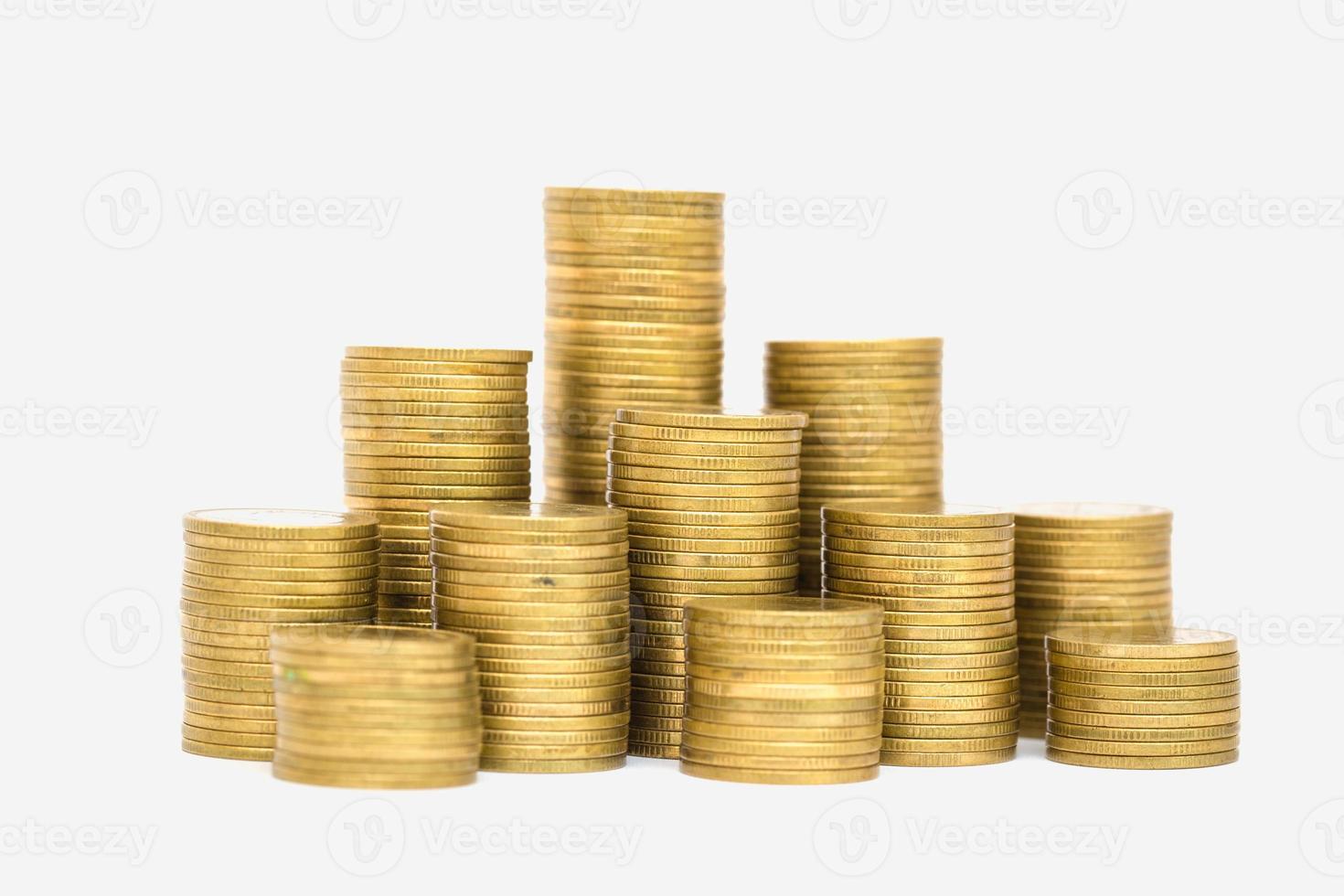 Gold coins stacks isolated on white background. photo