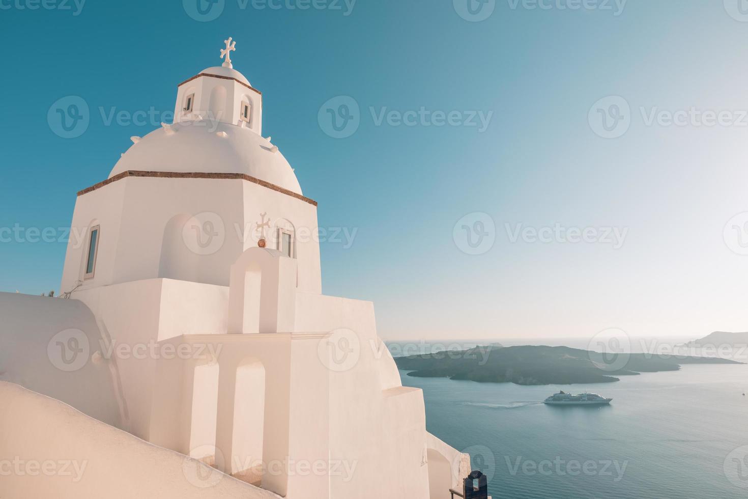 Landscape with greek bell tower, Santorini Island, Greece. Beautiful sea view with cruise ship and volcano. Wonderful travel landscape, summer vacation background. White and blue architecture photo