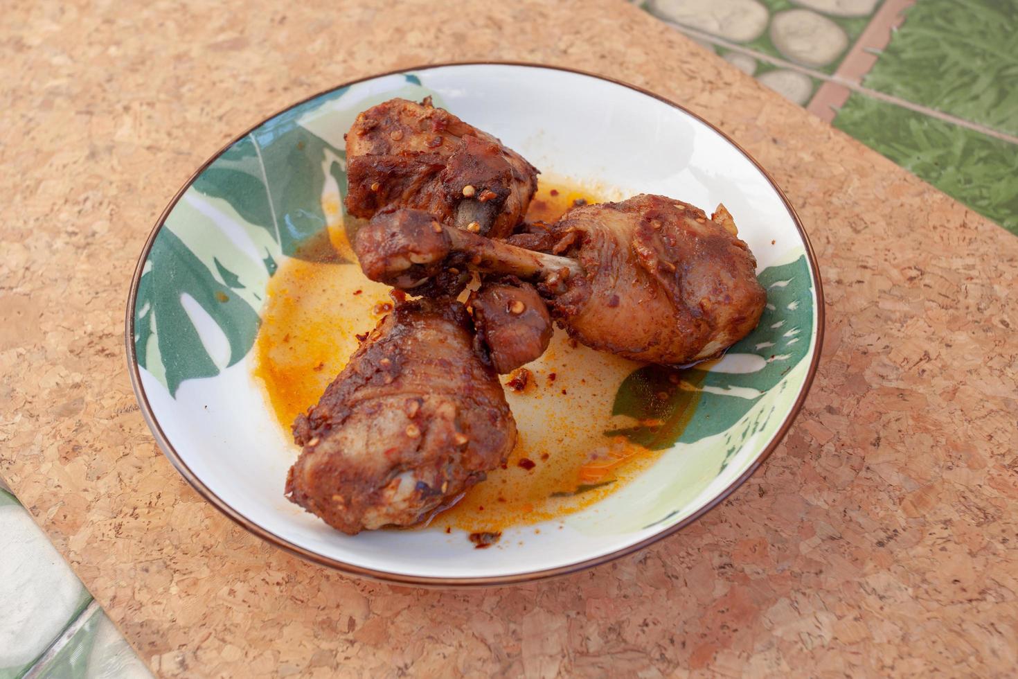 Thai food, chicken leg with mala sauce photo