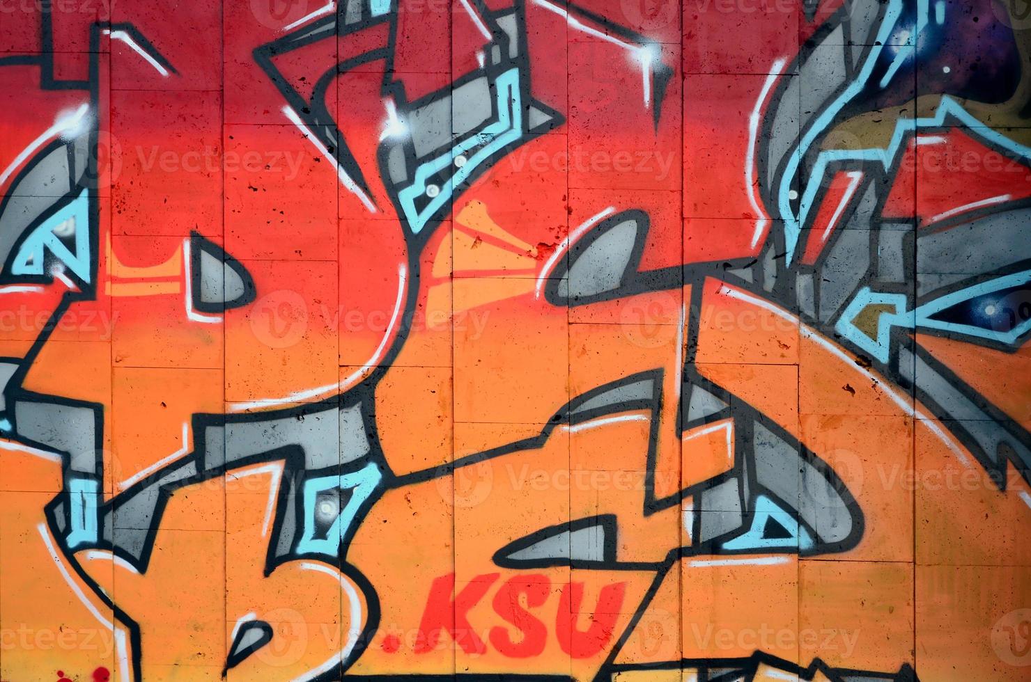 un fragmento de grafiti detallado de un dibujo realizado con pinturas en aerosol sobre una pared de baldosas de hormigón. imagen de fondo del arte callejero en cálidos tonos rojos foto