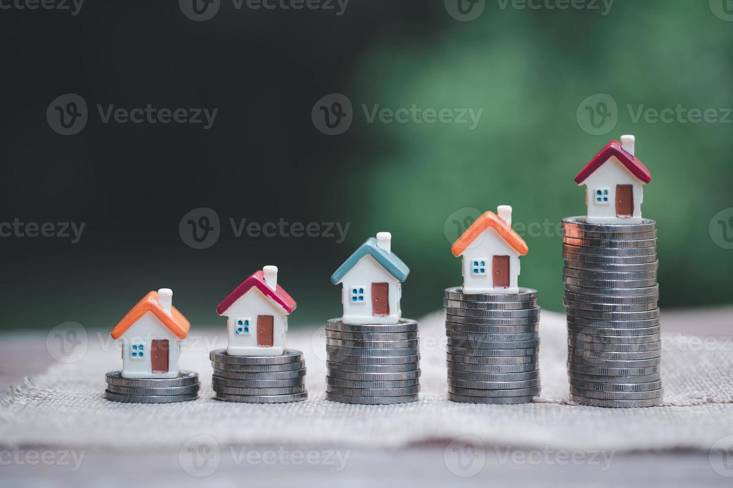 planning savings money of coins to buy a home, concept for property ladder, mortgage and real estate investment. for saving or investment for a house, growing business photo
