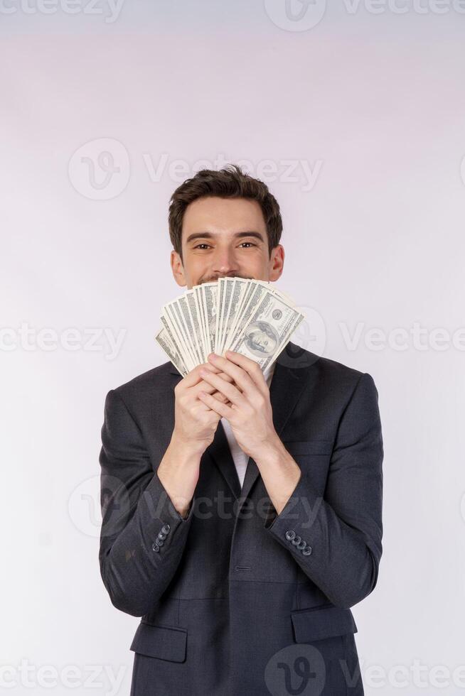 Portrait of a cheerful man holding dollar bills over white background photo