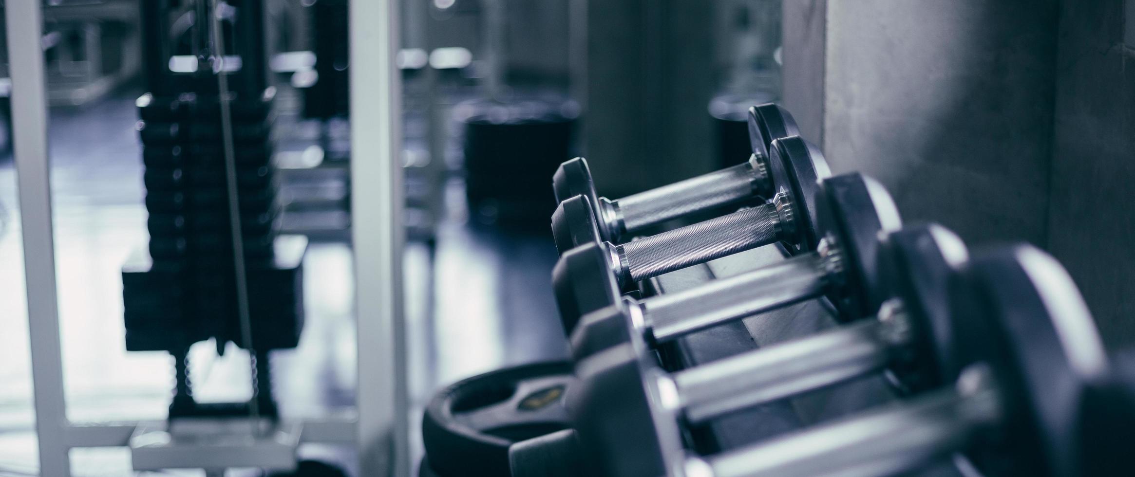 Row of dumbbells  background in the fitness photo