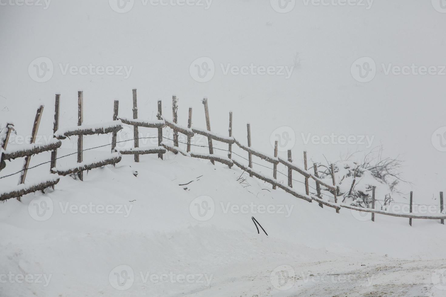 An abundant snowfall in the Romanian Carpathians in the village of Sirnea, Brasov. Real winter with snow in the country photo