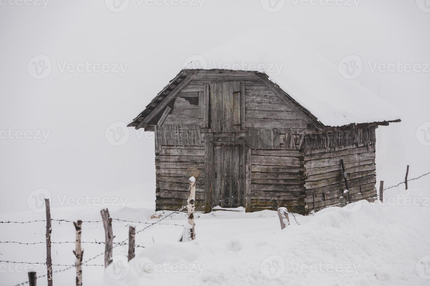 An abundant snowfall in the Romanian Carpathians in the village of Sirnea, Brasov. Real winter with snow in the country photo