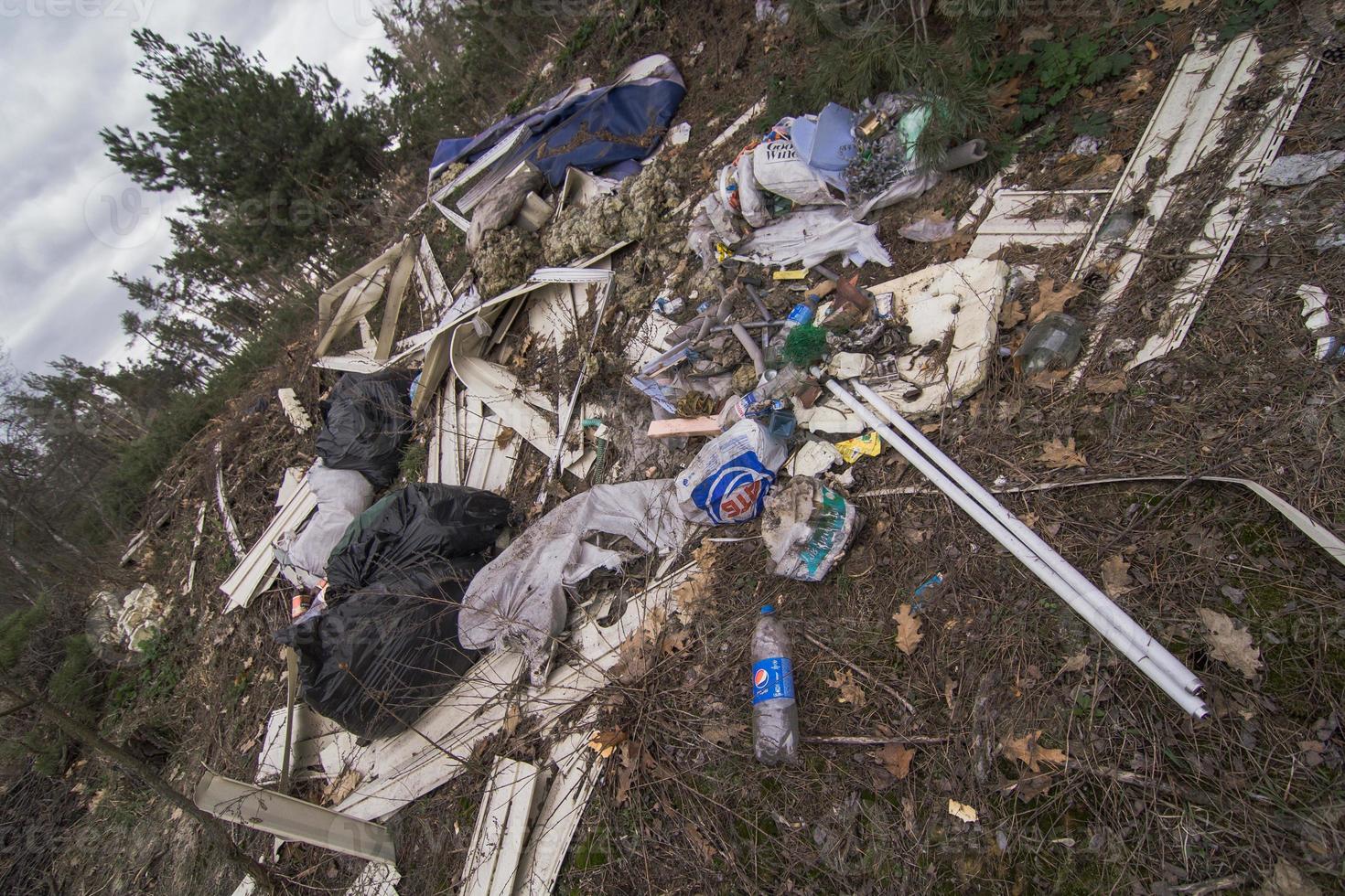 Close up illegally dumping garbage in park concept photo