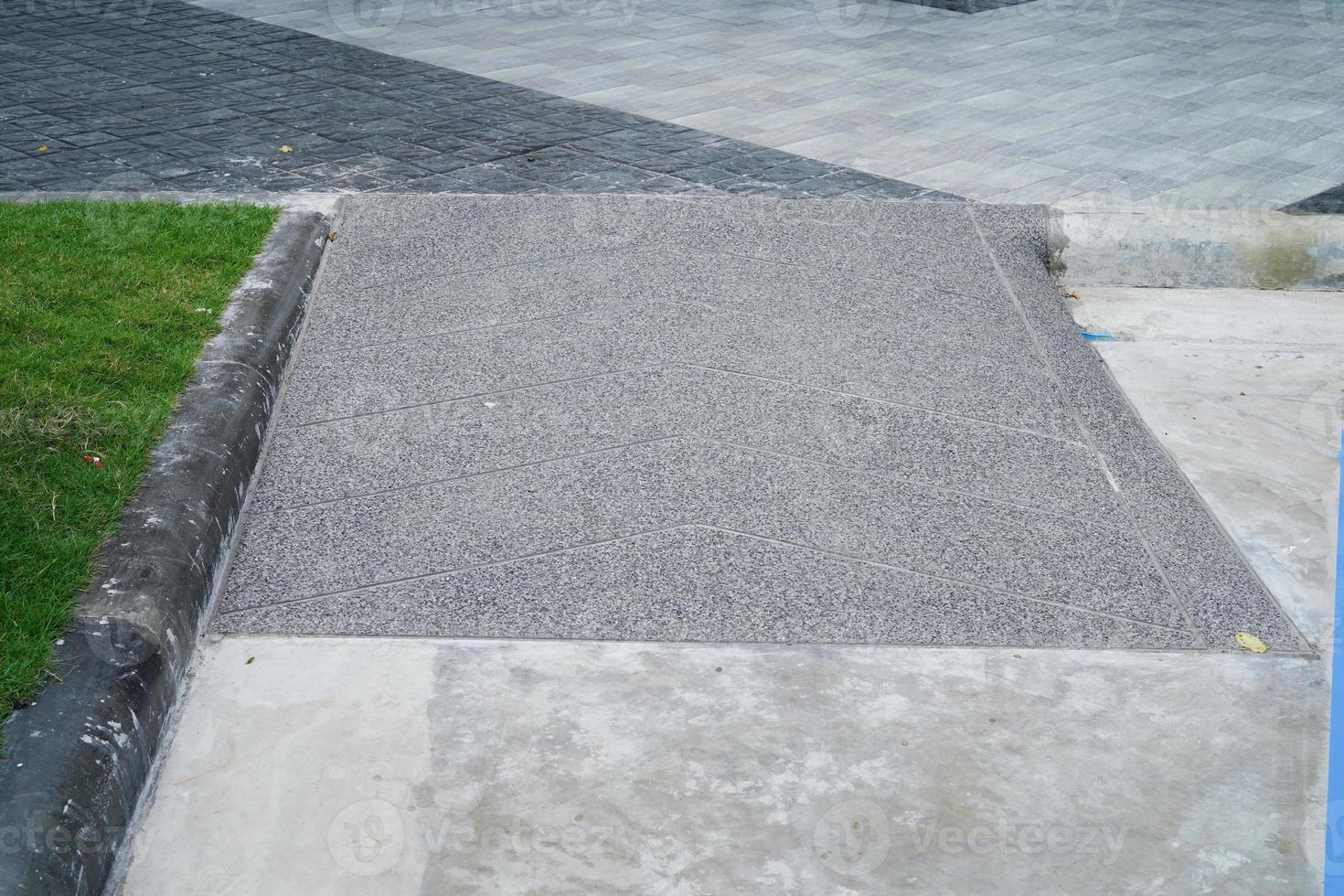 Building entrance trail with ramp for old or cannot self help disability person on wheelchair. photo