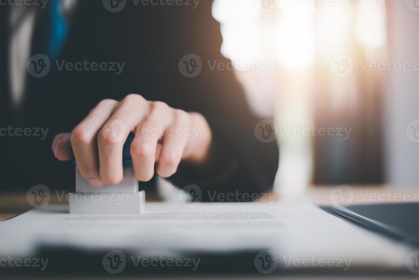 signing a business contract, Approval and confirmation of contract documents, the warranty certificate, approval stamp, business owner validates and manages business documents and agreements photo