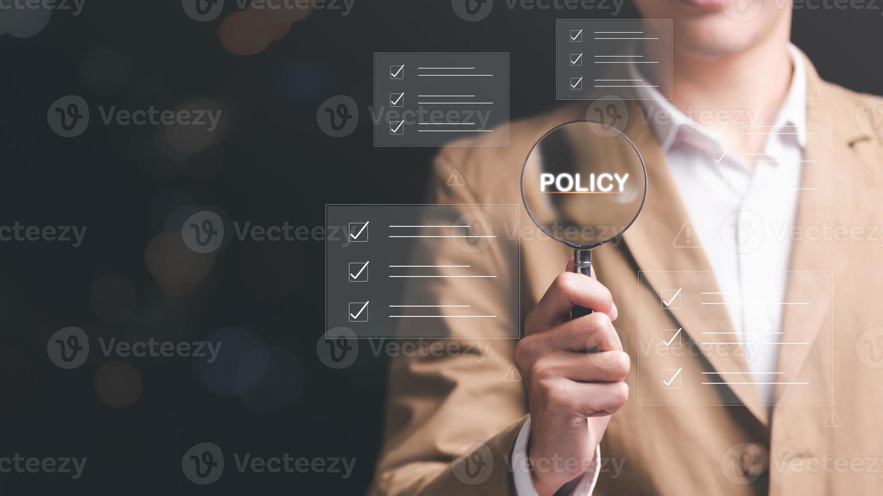 Businessman holding a magnifying glass with icons, steps review concept,Go through documents with checkbox lists, rules of conduct and policies,Company Articles of Association Terms and Conditions photo