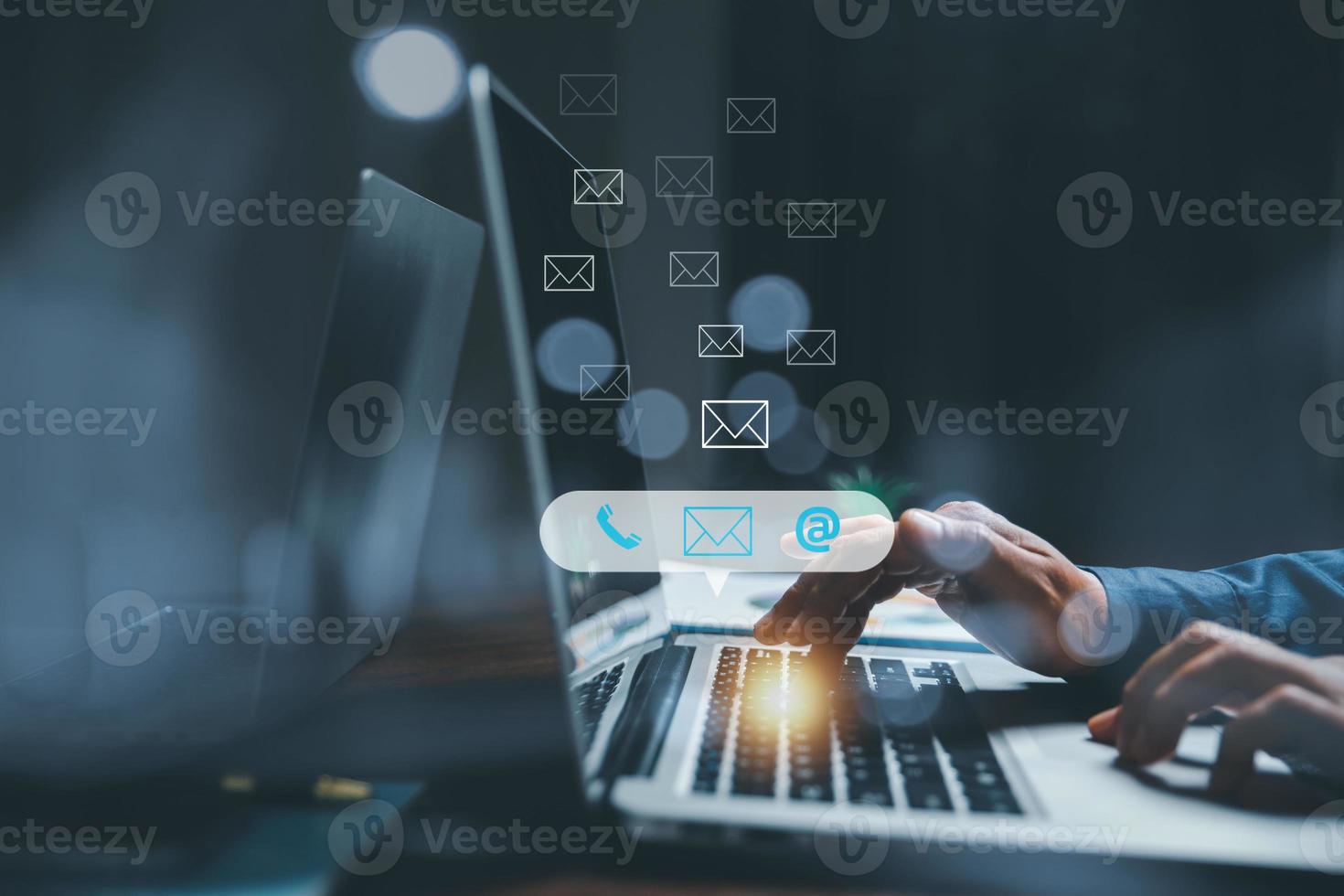 Customer support hotline contact us people connection concept. Web page online customer service technology idea. Businesswoman using computer with email, call phone, address, Chat message icons. photo