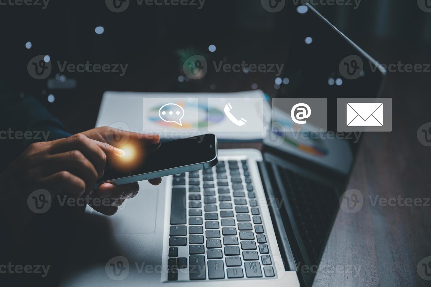 Customer support hotline contact us people connection concept. Web page online customer service technology idea. Businesswoman using smartphone with email, call phone, address, Chat message icons. photo