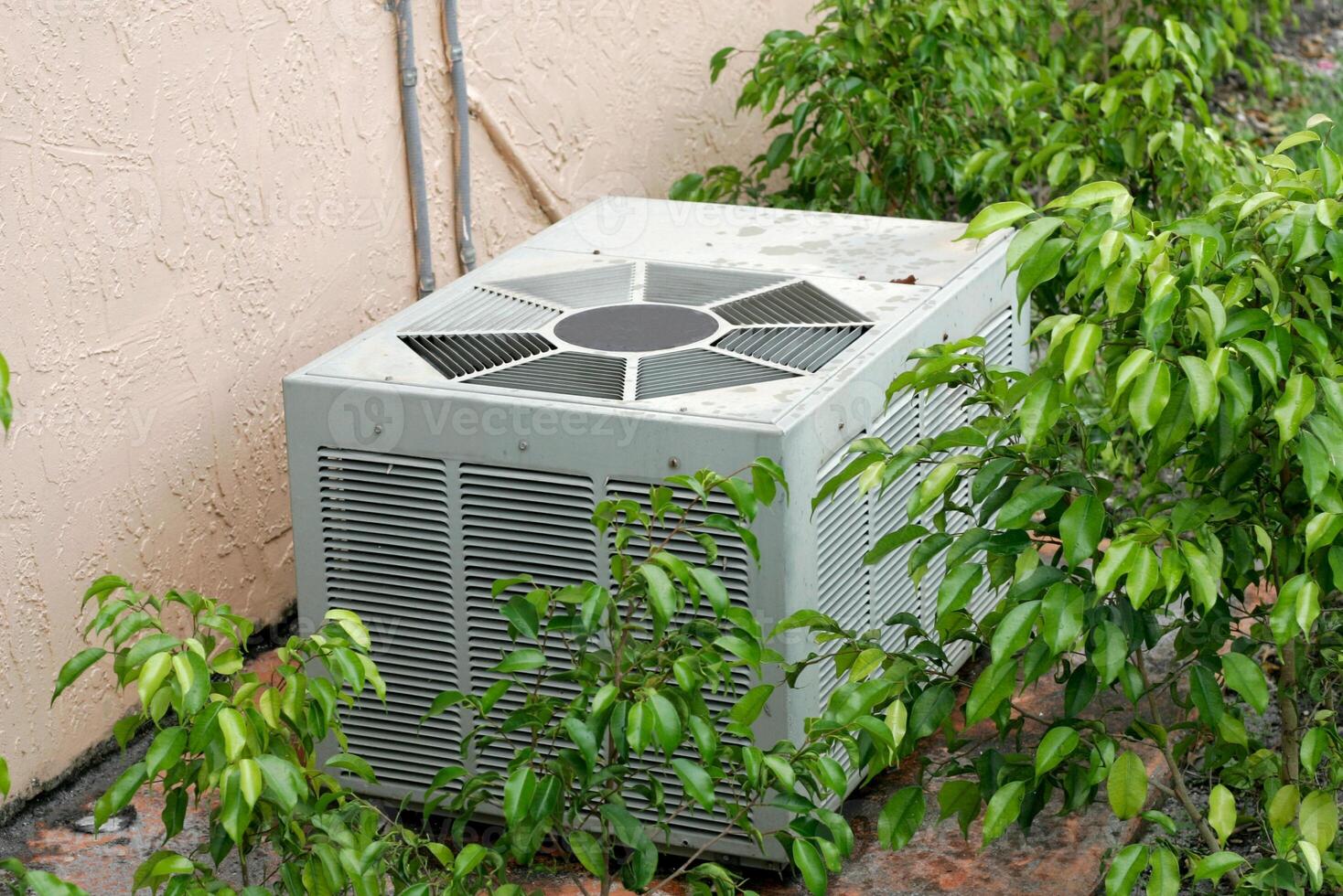 Air conditioner inside the room, Hand holding control switch of home air conditioner, Air