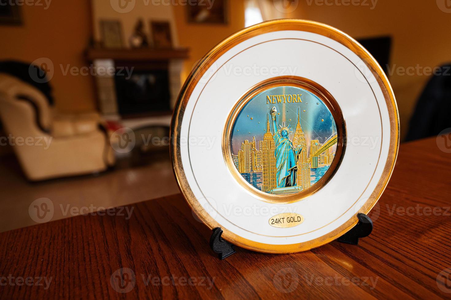 New York souvenir gold plate on a stand at home. photo