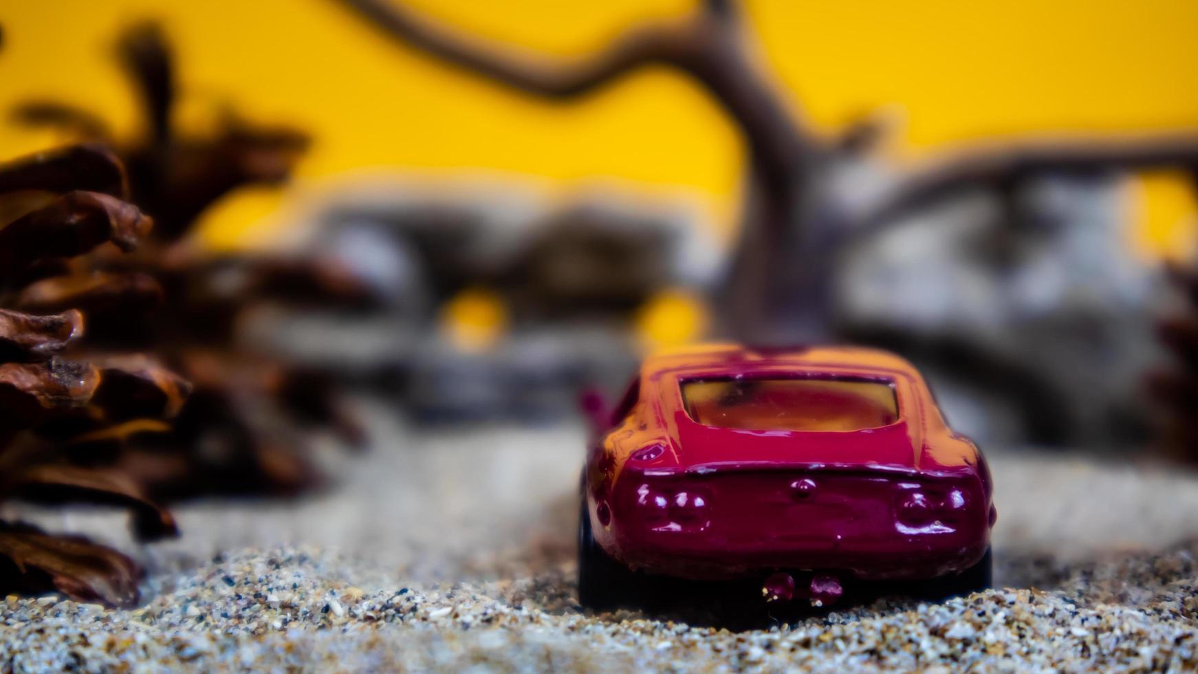 Minahasa, Indonesia  saturday, December 2022, a toy car among the pinecones photo