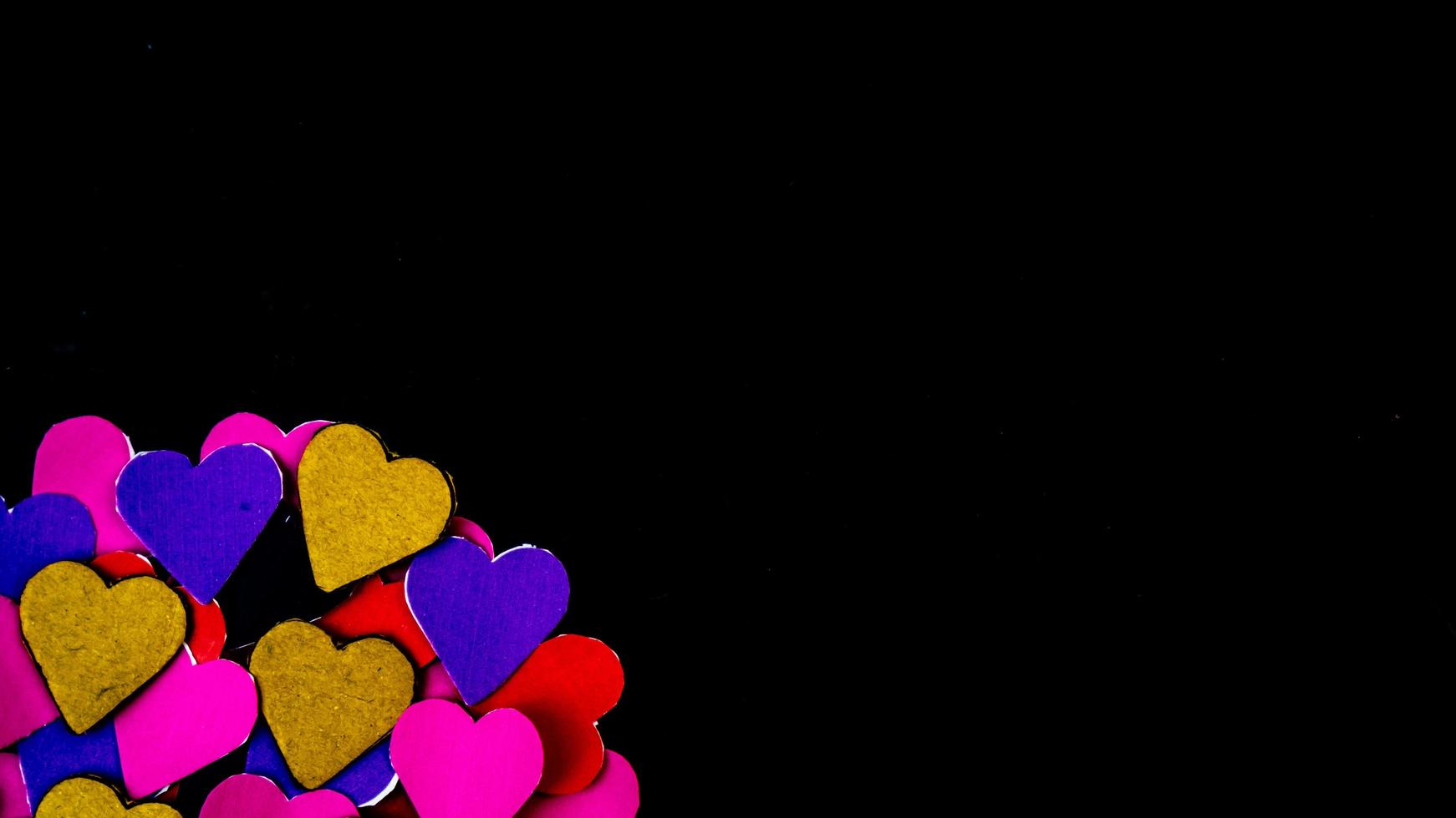 multicolored heart on black background for valentine's day photo