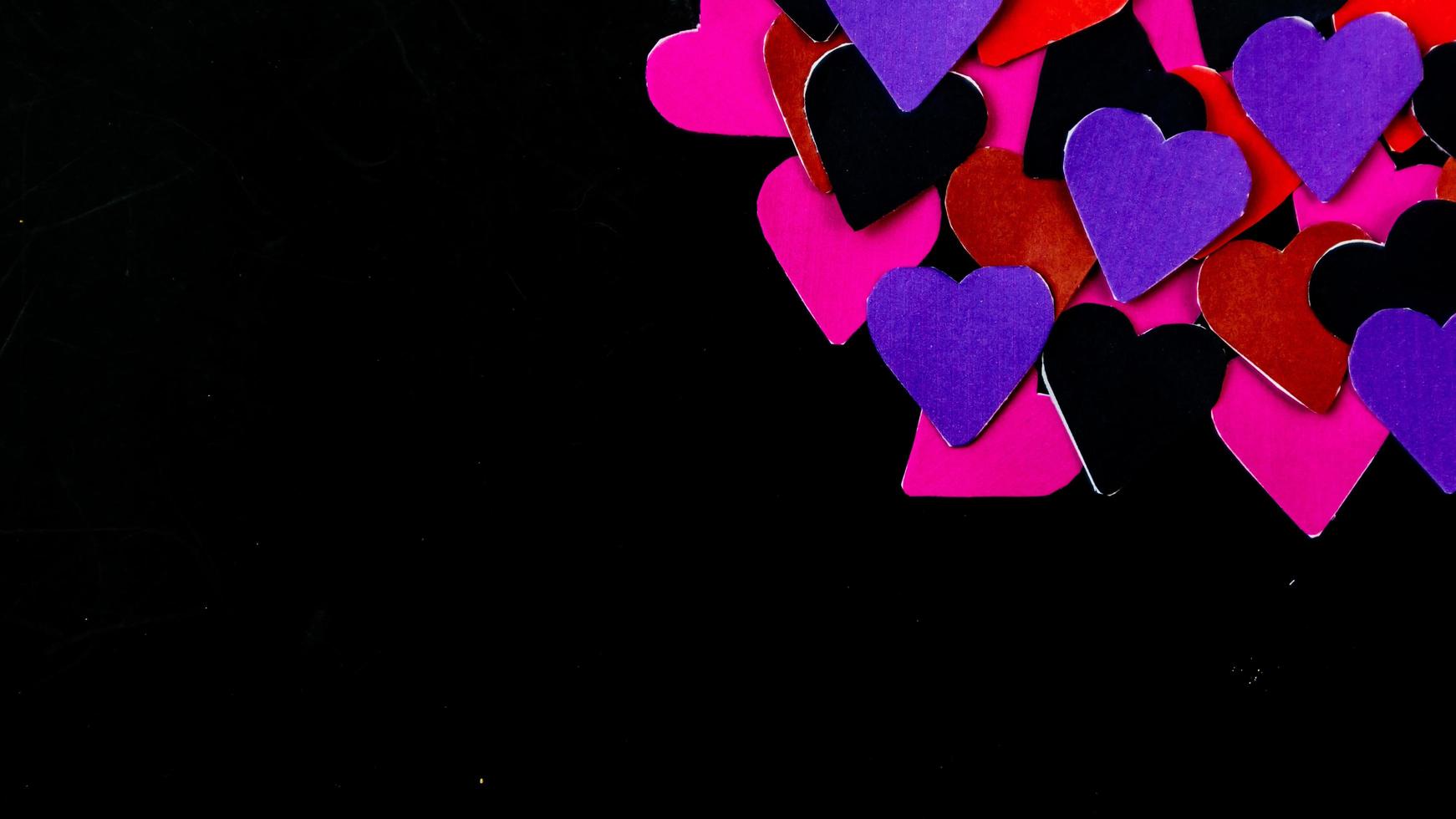 multicolored heart on black background for valentine's day photo