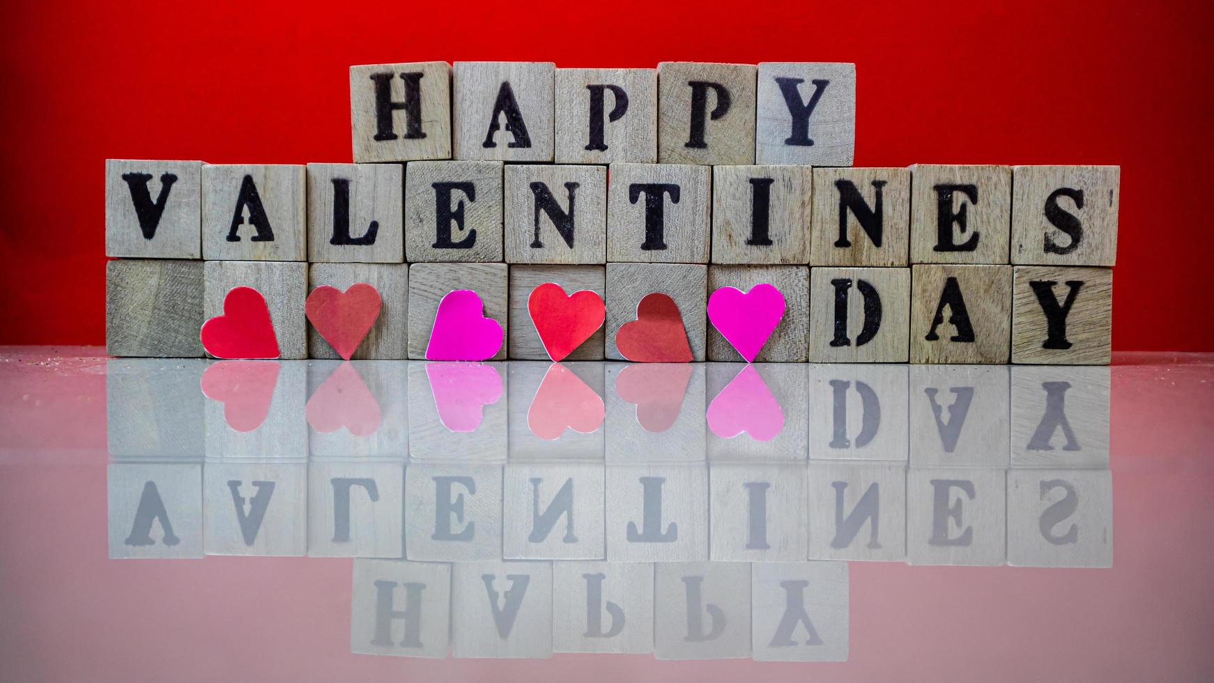 Happy valentine day on wooden blocks photo