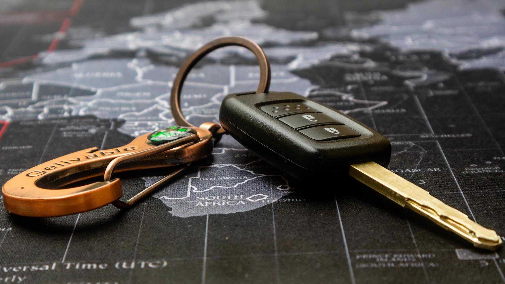 black car keys on black map photo