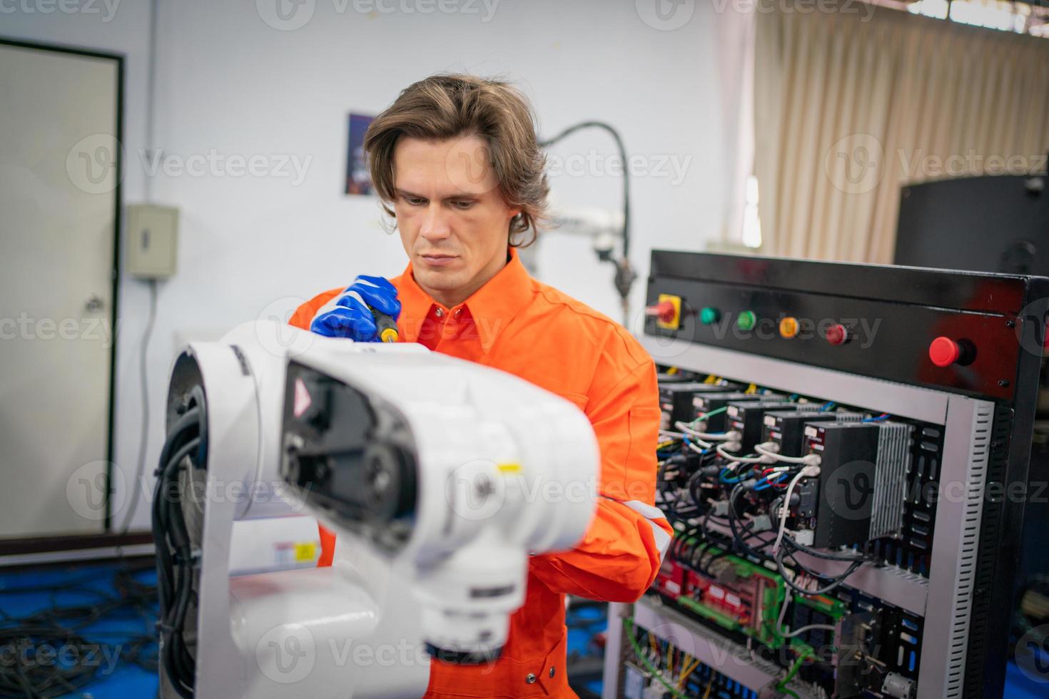 Maintenance engineering repair automatic welding robotic arm machine at production line in the industry factory. photo