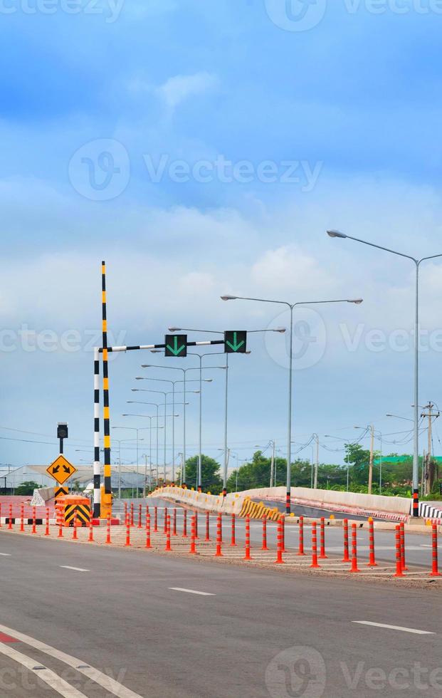 Traffic Light Signal, Road Markings and Pass Either Side , Dangerous Obstruction Warning Sign countryside Highway in Thailand photo