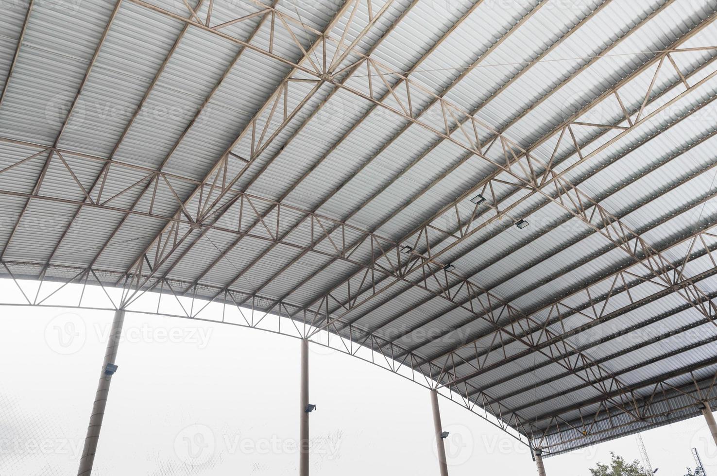 Steel structure Roof detail ,Indoor empty warehouse factory ,Curve line Steel structure Detail of Metal roof construction photo
