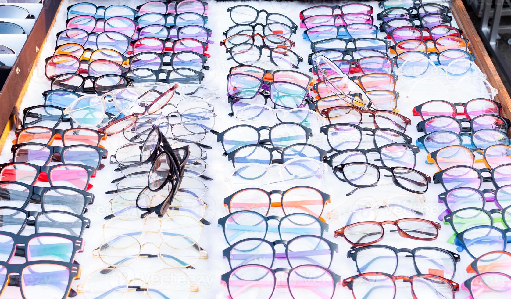 Group of Many Colourful glasses in rows,choice of glasses in the optical store photo