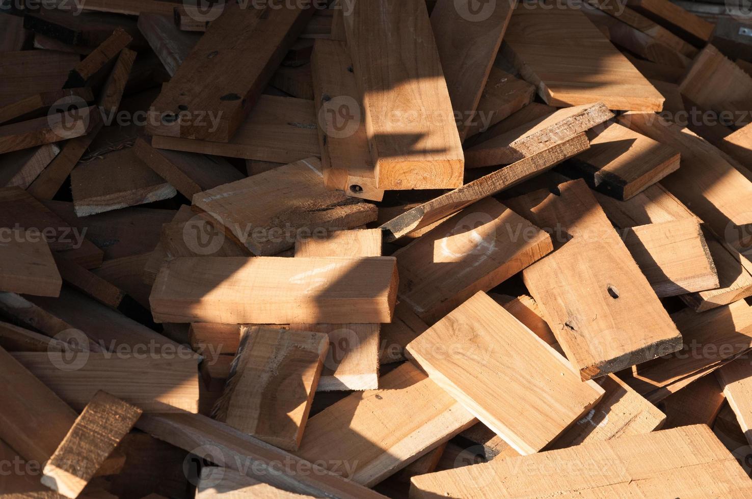 Pile of wood logs for build Furniture production,sew natural wood scraps, ready to recycle and reuse process in improved waste management under efficient sustainable approach to save environment photo