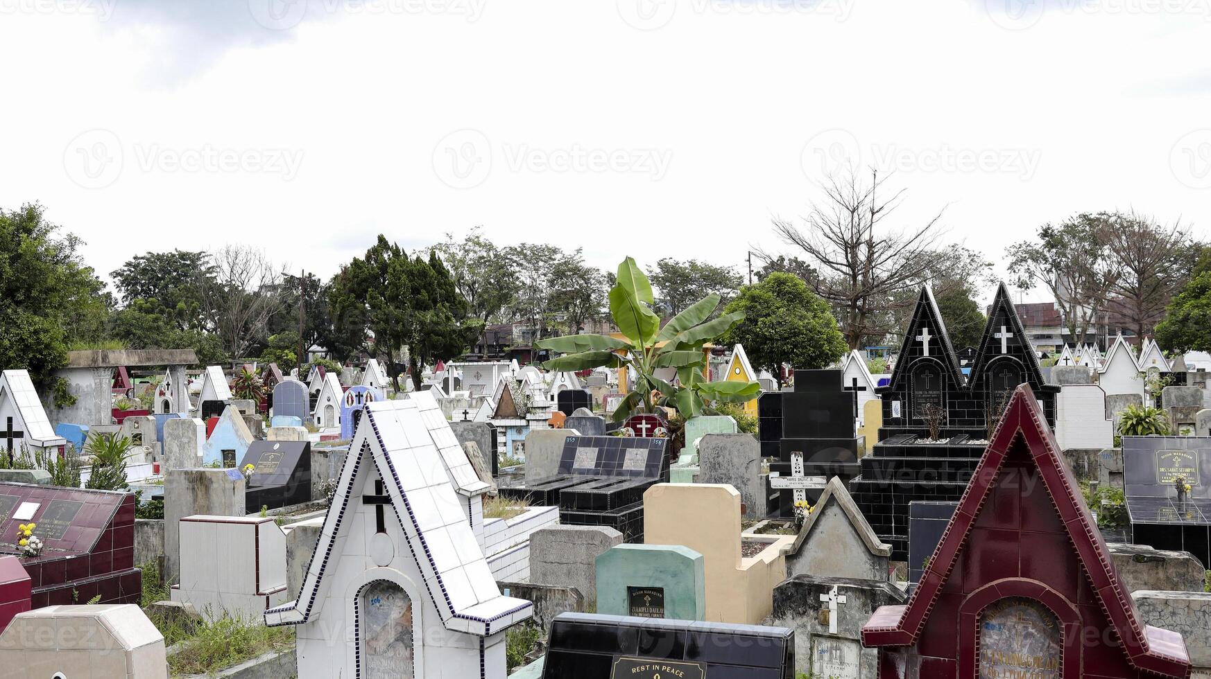 Public cemetery with varied graves. photo