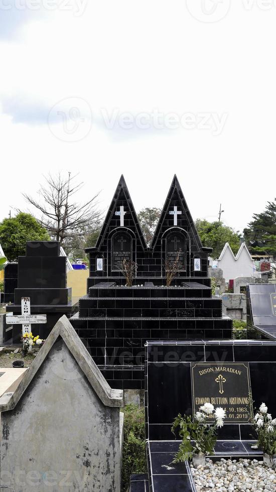 Public cemetery with varied graves. photo