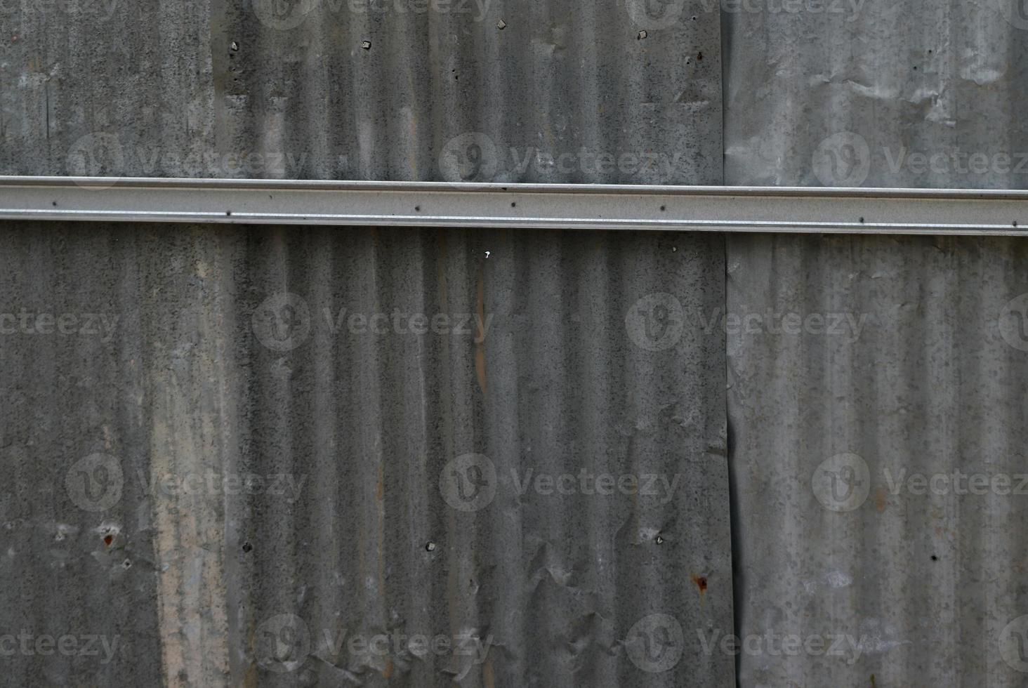 Wall surface elements with rough textures, designed to resemble the roof of a house photo