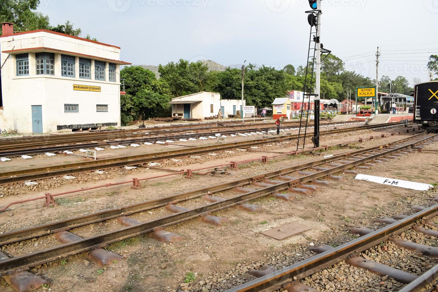 View of Toy train Railway Tracks from the middle during daytime near Kalka railway station in India, Toy train track view, Indian Railway junction, Heavy industry photo