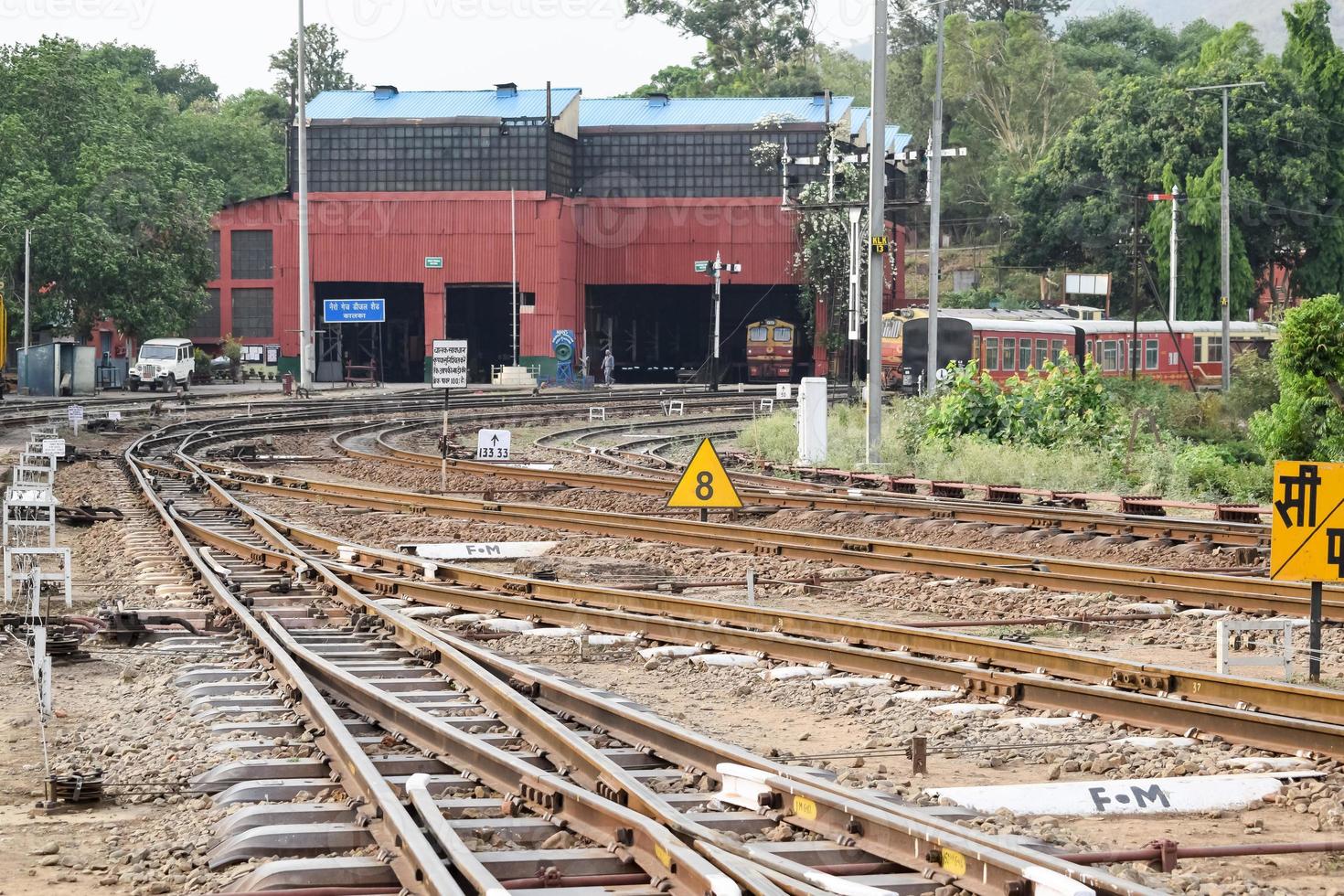 View of Toy train Railway Tracks from the middle during daytime near Kalka railway station in India, Toy train track view, Indian Railway junction, Heavy industry photo