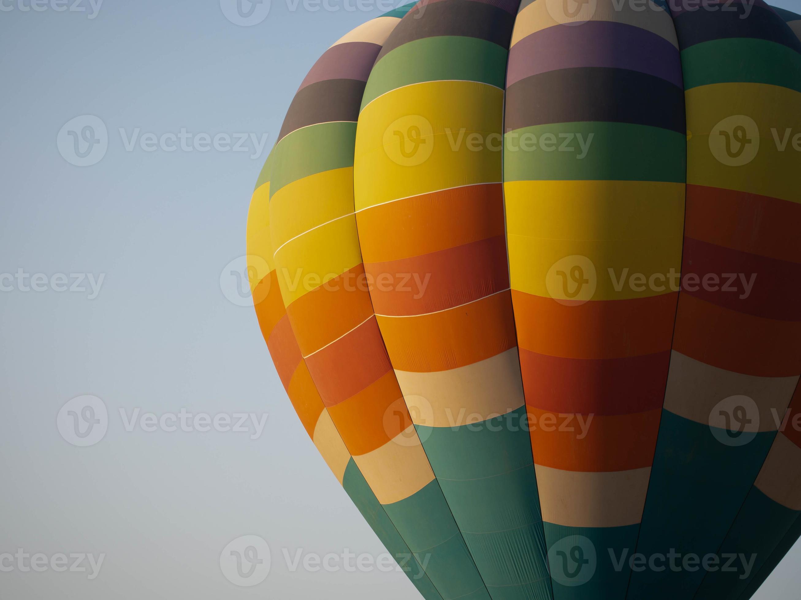 Balloon rainbow colorful helium circle fly blue sky background