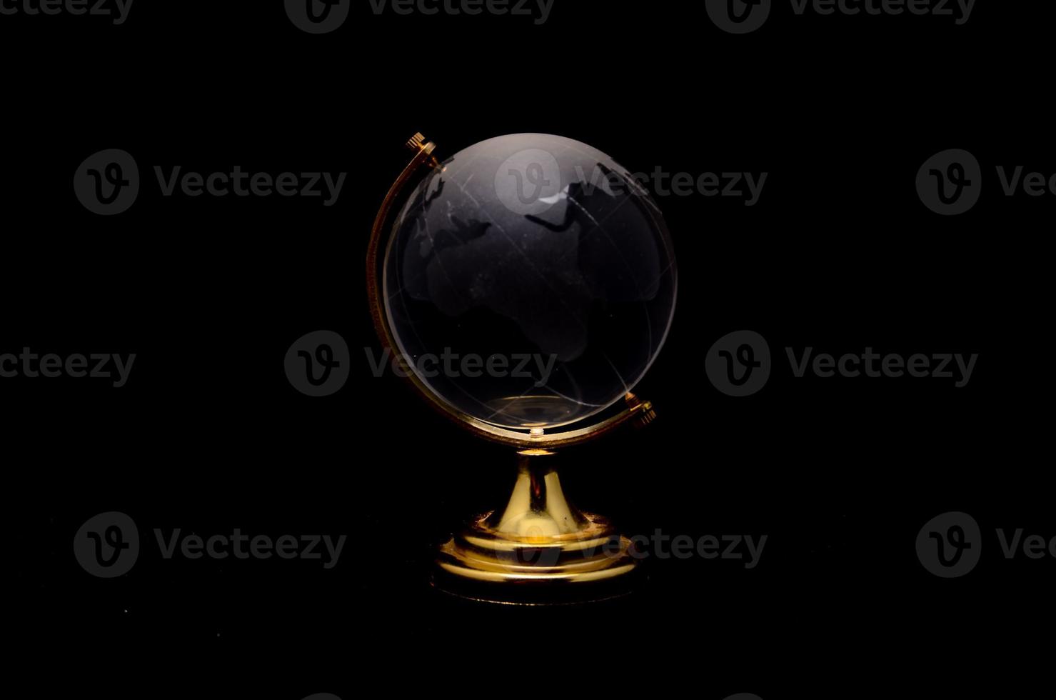 Black globe on black background photo