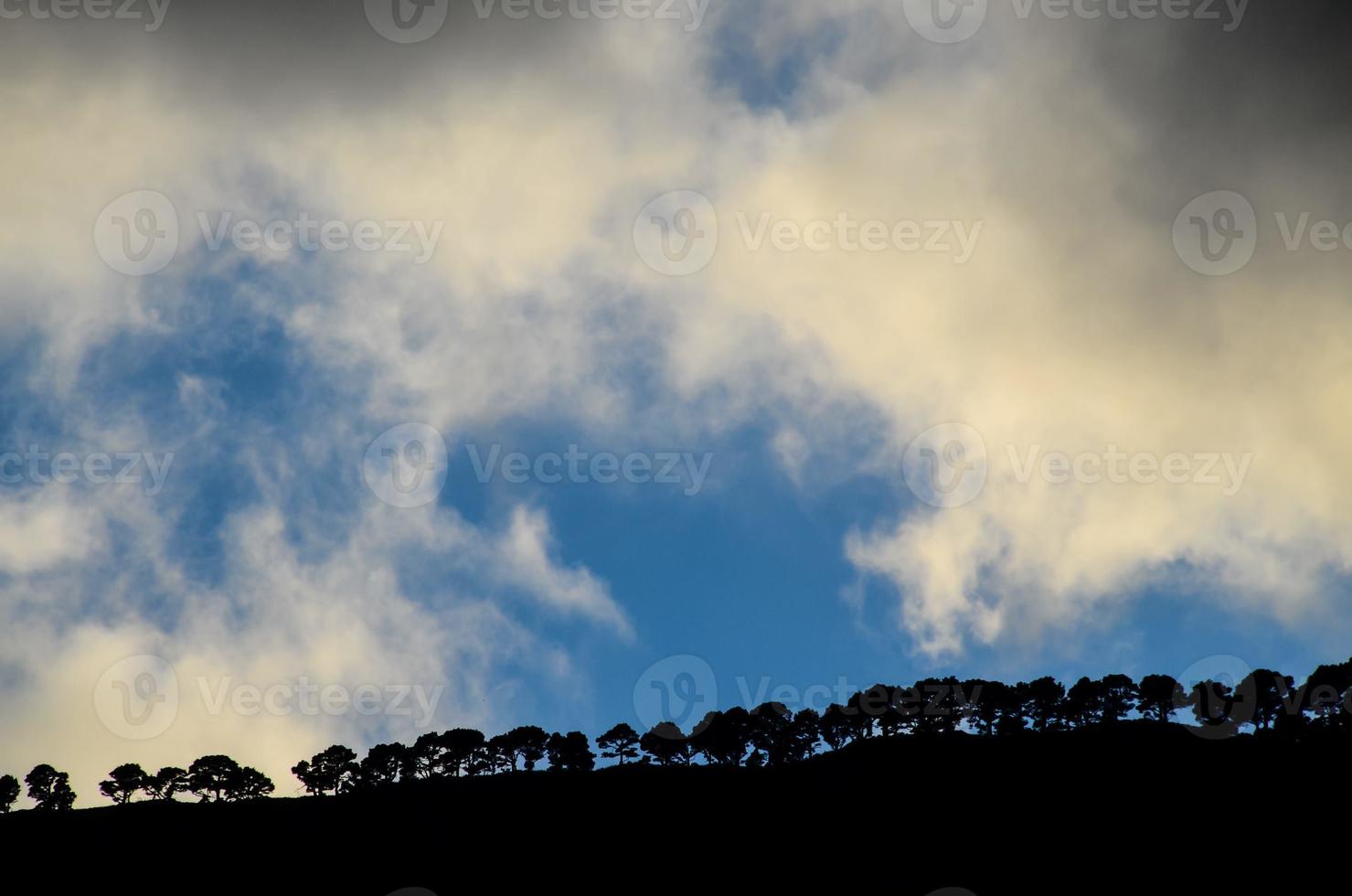 Dark clouds over the mountain ridge photo