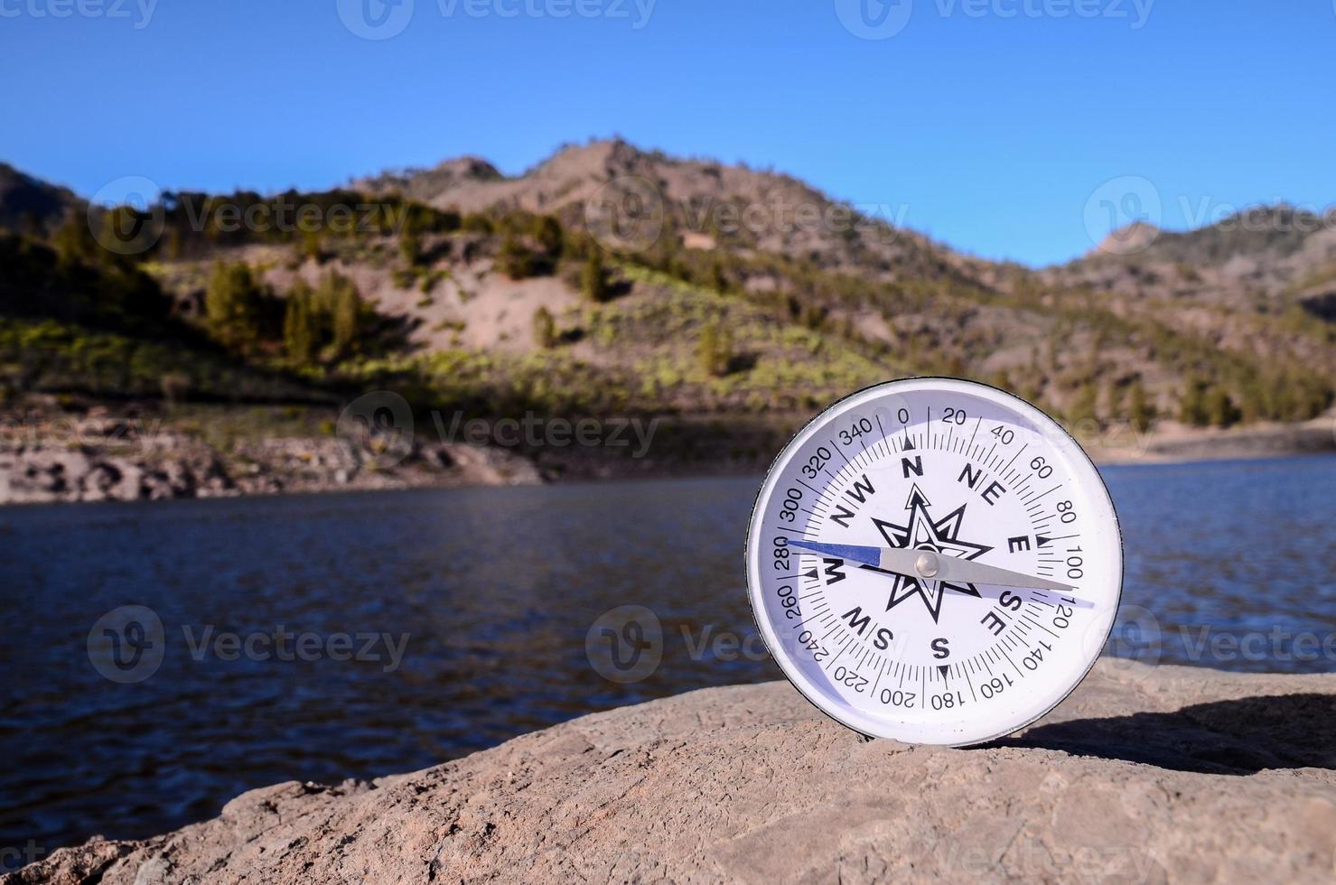 Compass on a rock photo