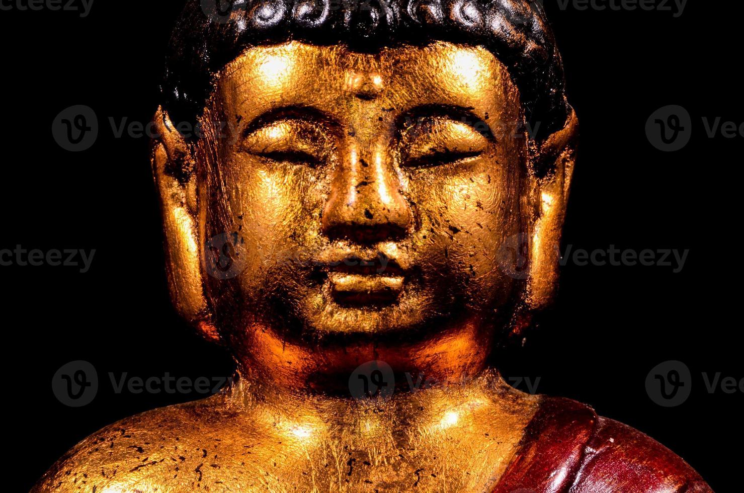 Buddha statue on black background photo