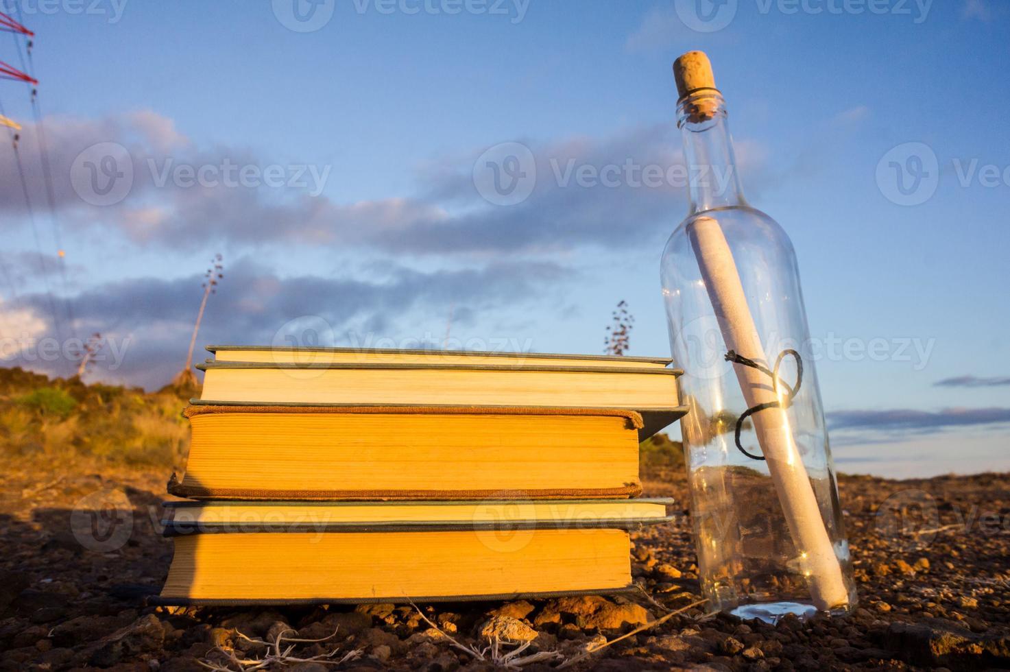 Message in a bottle and books photo