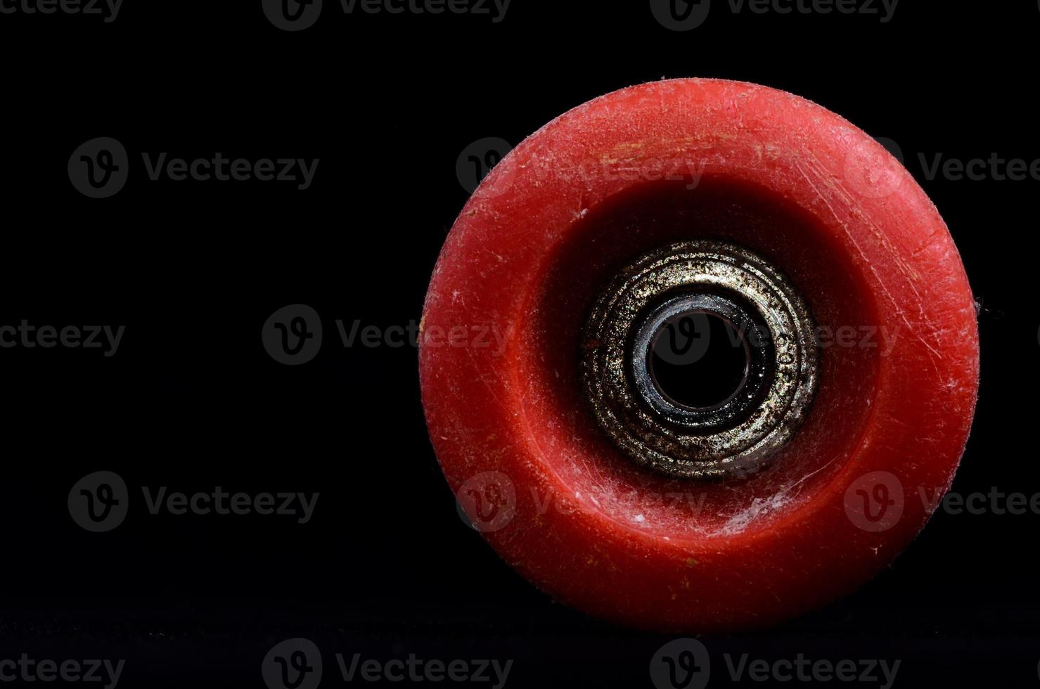 Skateboard wheel on black background photo