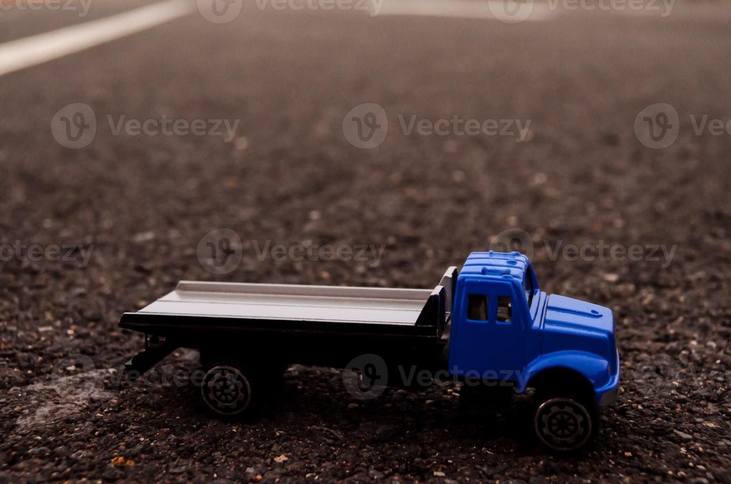 Toy truck on the road photo