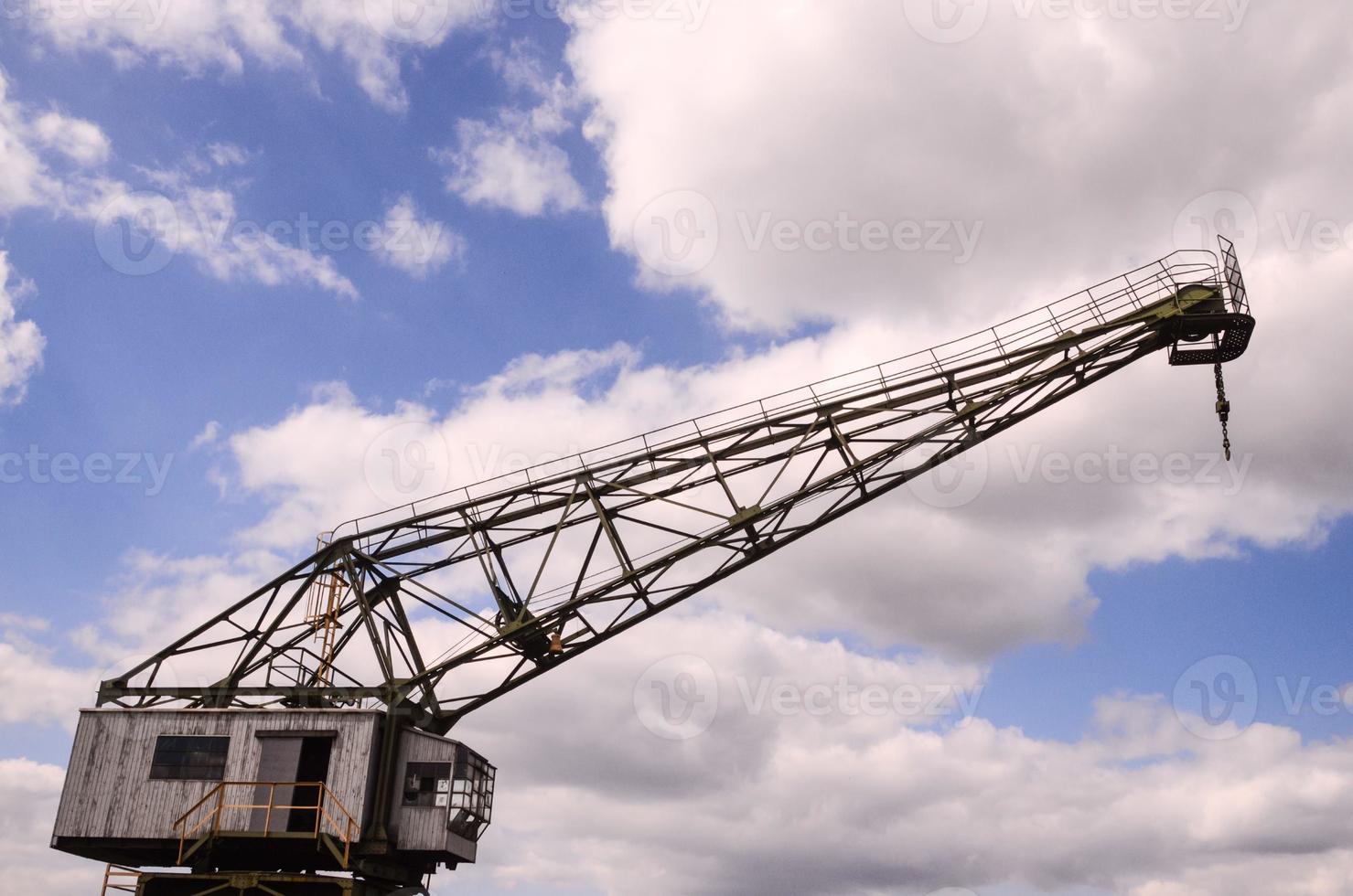 Crane under cloudy sky photo